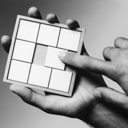 a puzzle being solved in someones hands