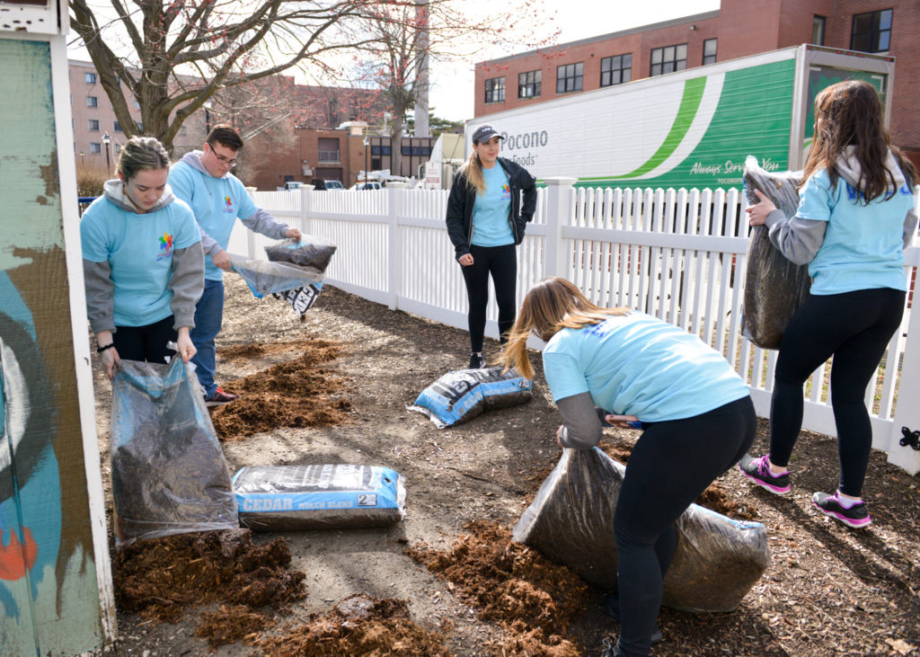 Putting out mulch at the WCSU daycare center