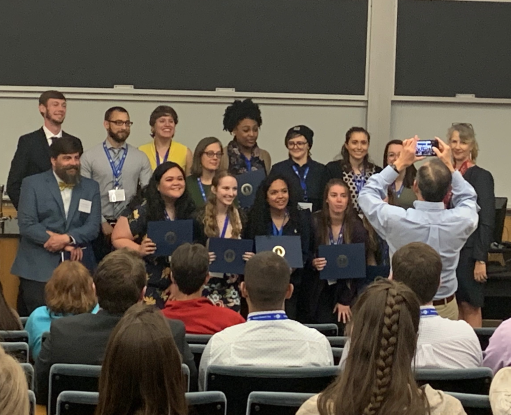Photo of recipients of the Provost's Award at the 15th Annual Western Research Day Conference standing in the front of an audience