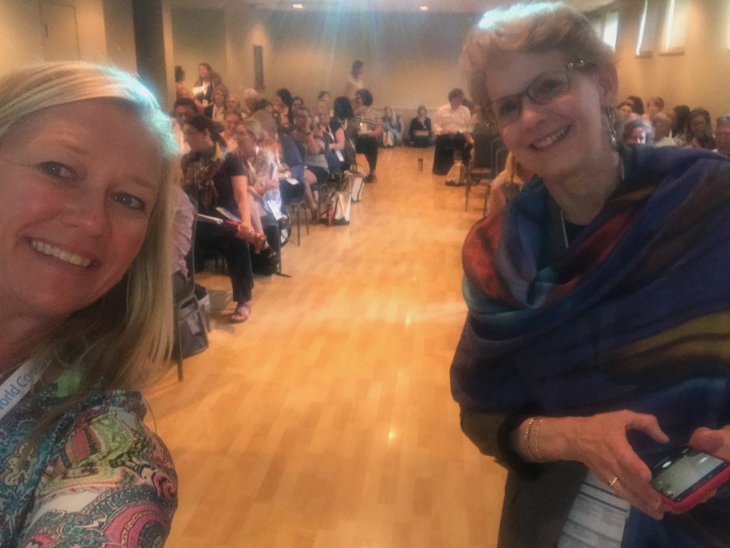 Image of Dr. Marcia Delcourt standing in a room of people attending the conference for the World Council for Gifted and Talented Children in Nashville, July, 2019.