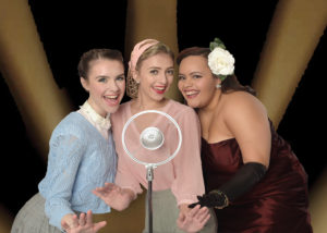 image of (l-r): Grace McGovern, Victoria Wall and Cynthia Rivera in a scene from "The 1940's Radio Hour"