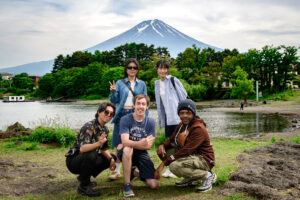 Collin Testa (center) with fellow foreign exchange students in front of Mount Fuji.